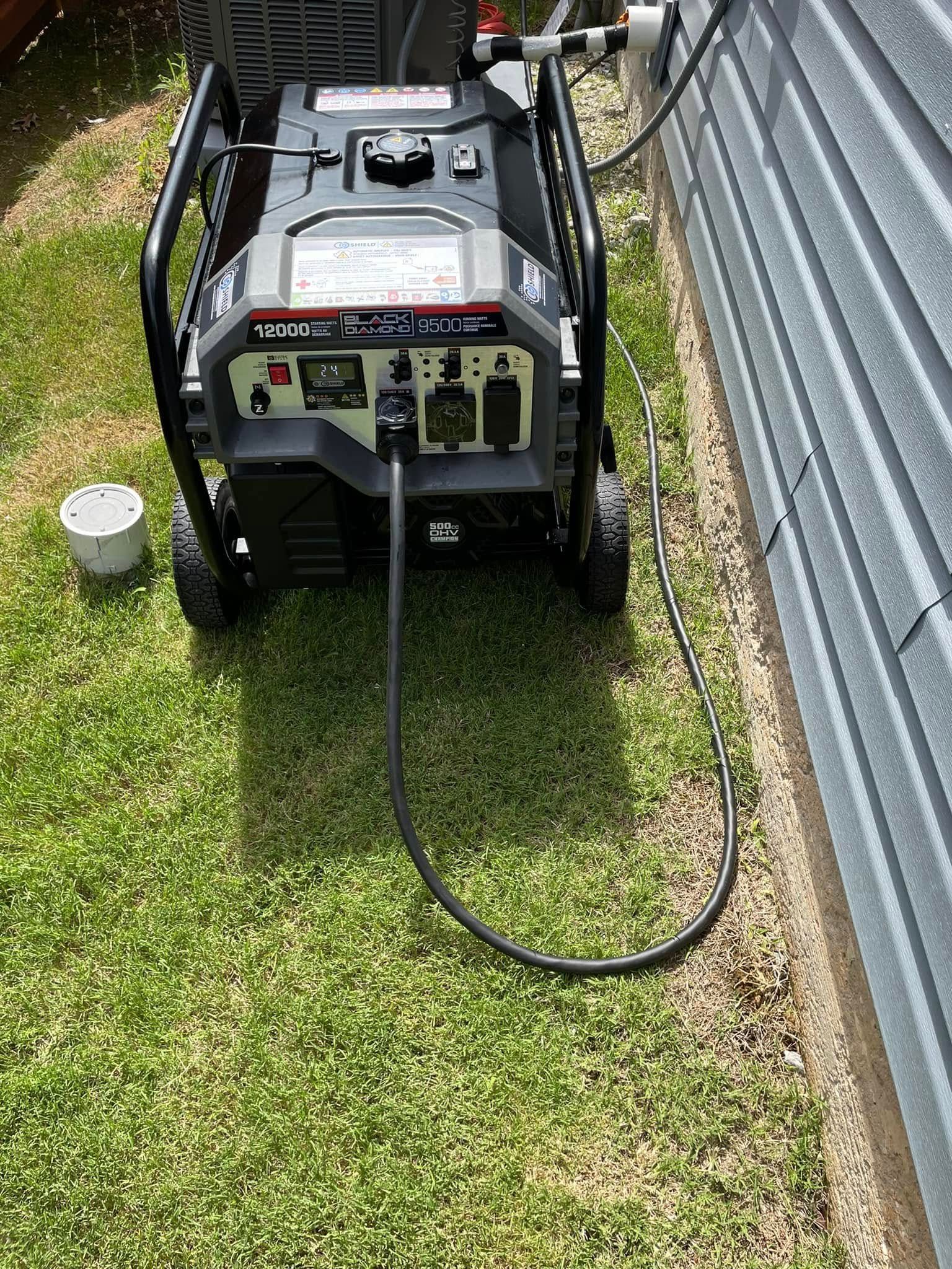 A generator is plugged into a wall next to a house.