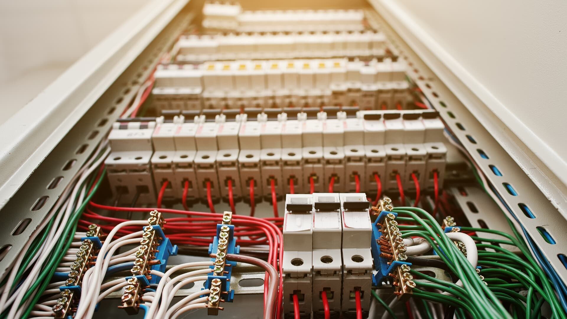 A bunch of wires are connected to each other in a electrical box.