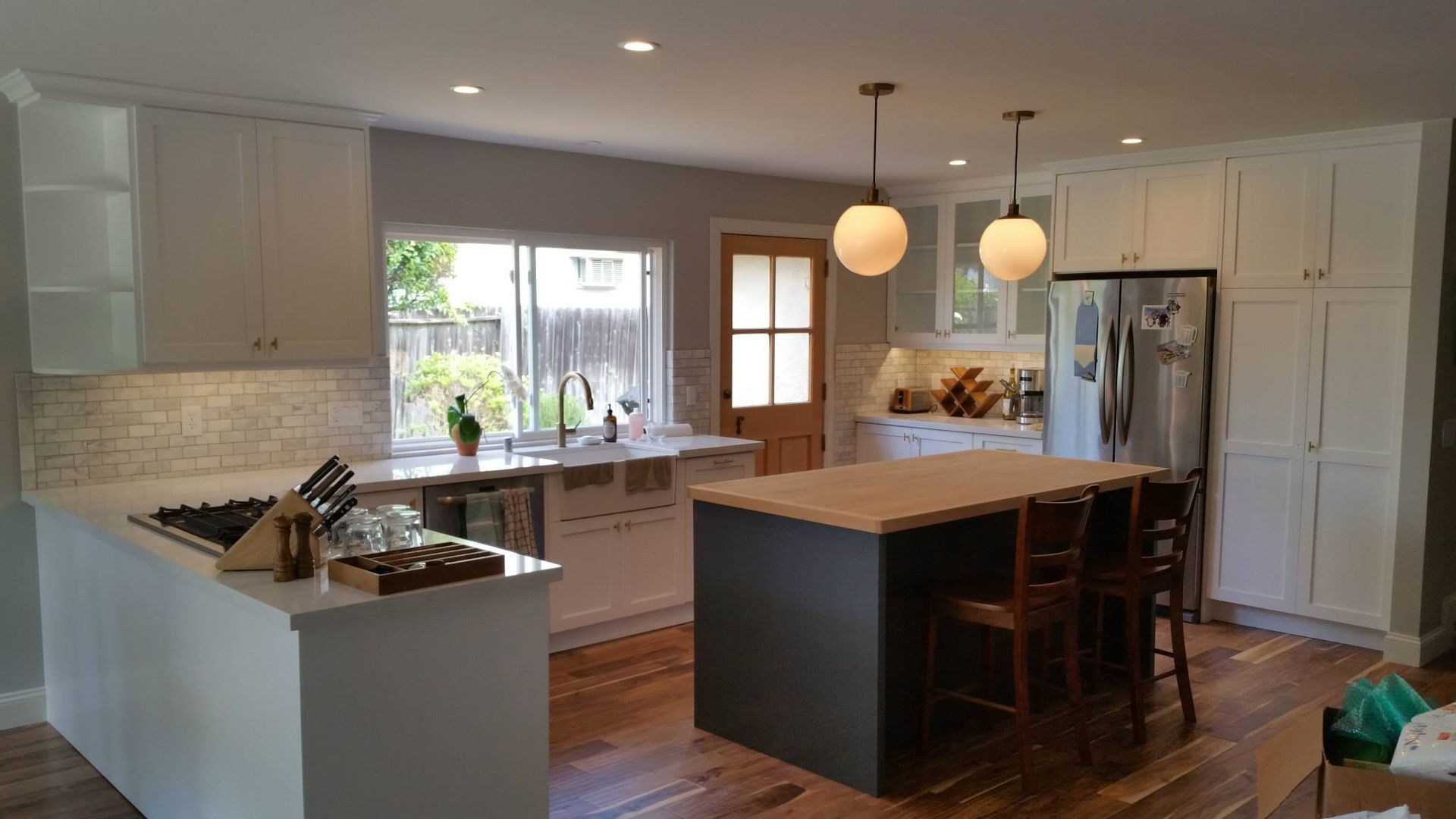 A Kitchen With A Counter Table - San Diego, CA - Acadia Design & Construction