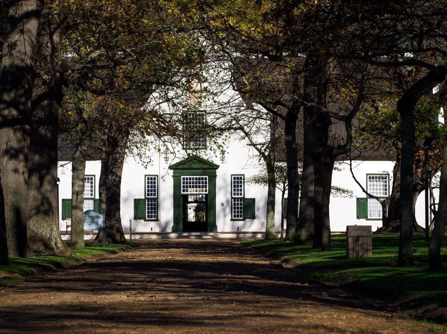 white and green building of Dutch Cape design influence