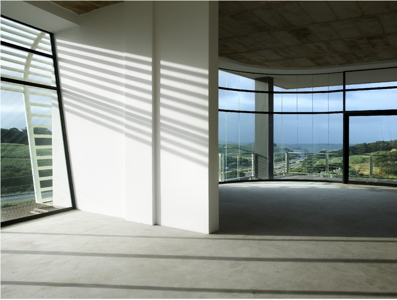 A large empty room with a lot of windows. SARS – Umhlanga