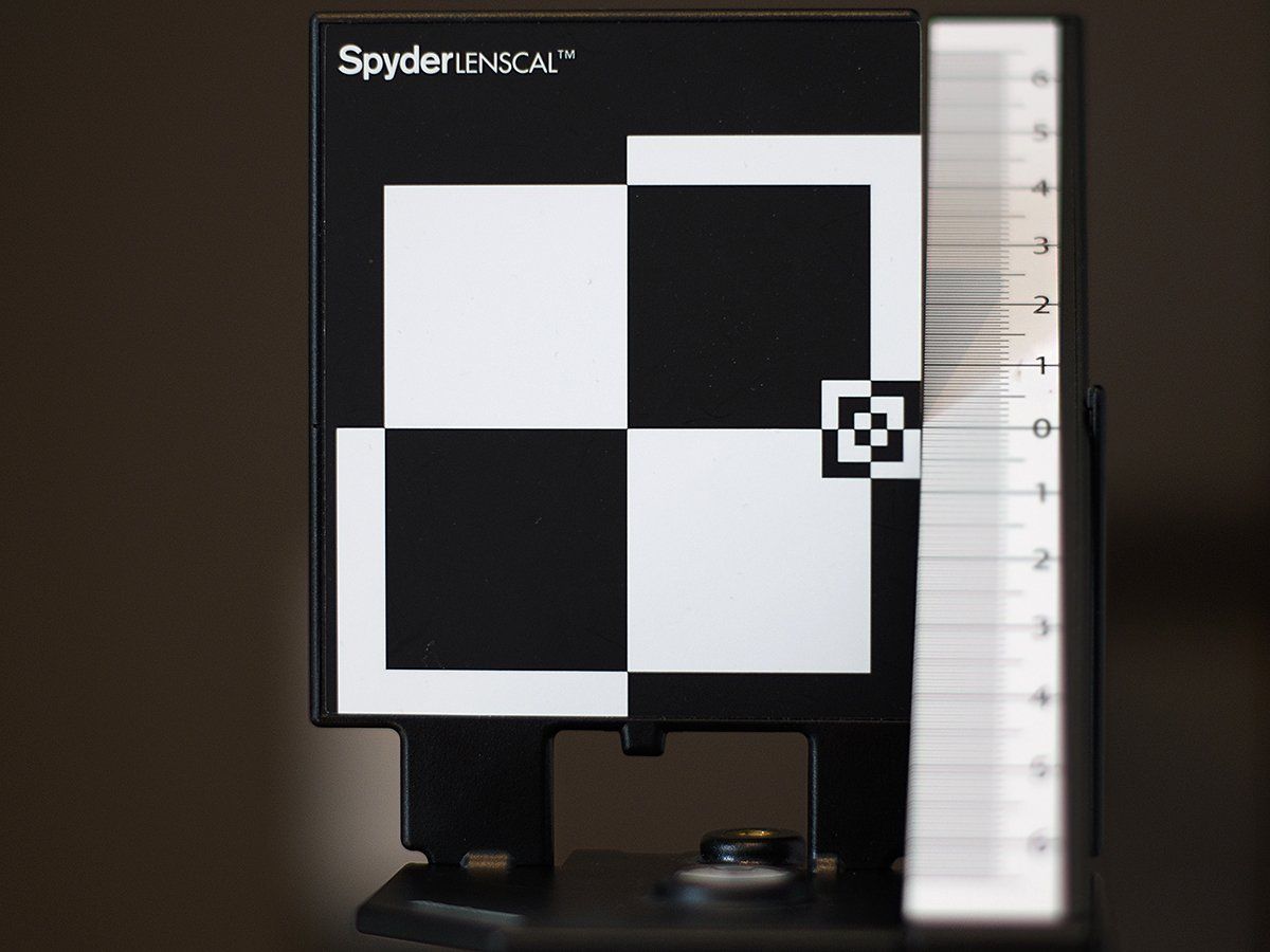 A black and white checkered board with the word spyder on it
