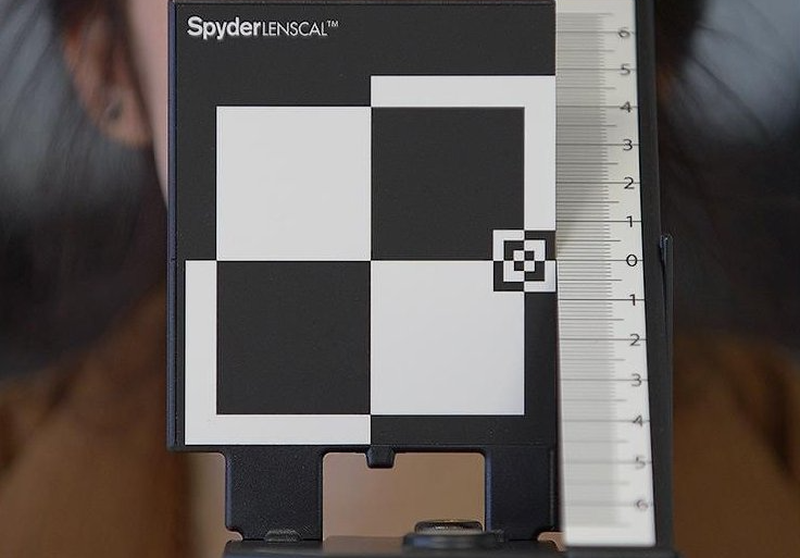A black and white checkered object with the word spyder on it