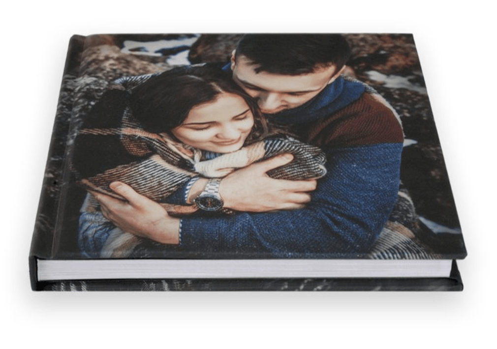 A book with a picture of a man and woman hugging each other.