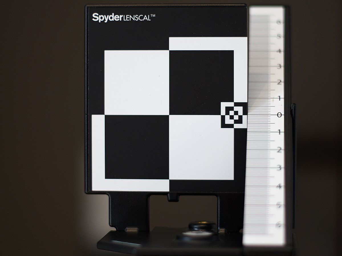 A black and white checkered item that says spyder on it
