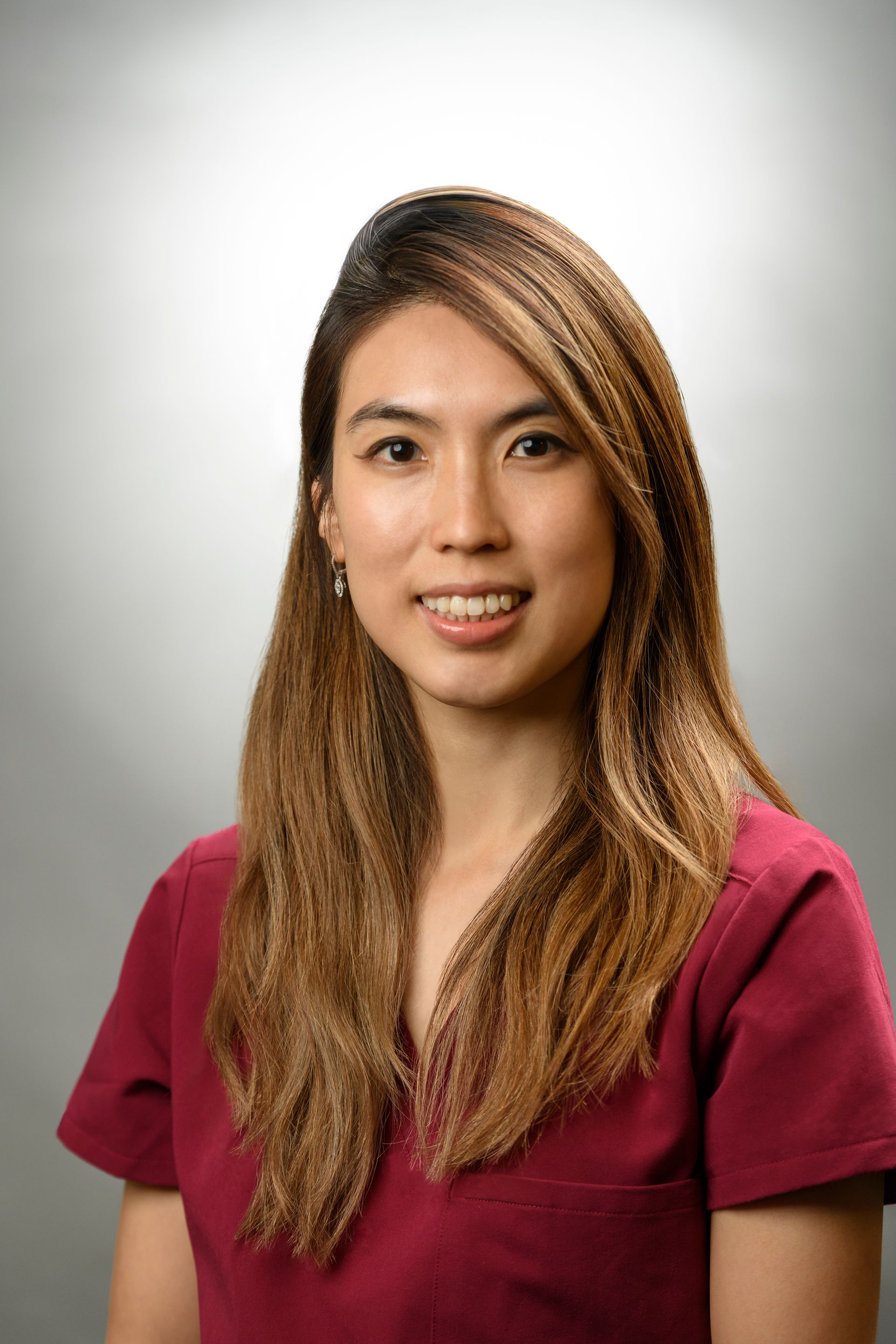 Silhouette of a person, head above shoulders, in gray on a white background.