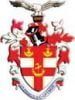 Coat of arms with red and white checkered shield, anchor, and eagle on top.
