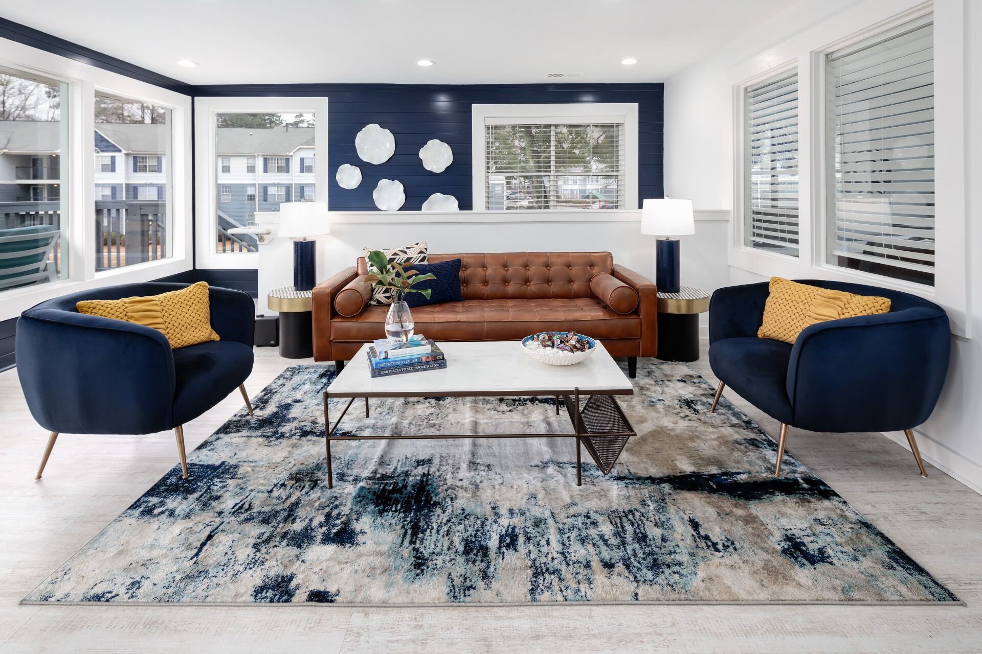 Family Room with Chairs, Couch, and Coffee Table | The Bentley at Marietta