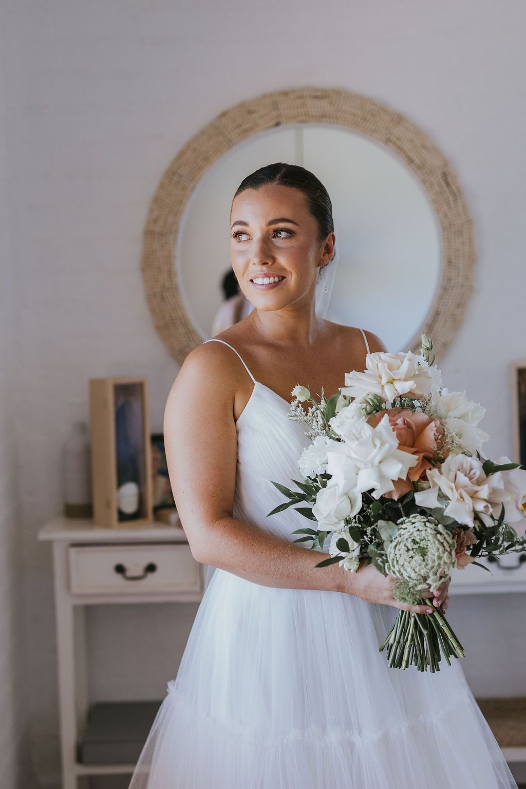 Bride is wearing a veil and holding a bouquet of flowers — Flowers in Wollongong, NSW