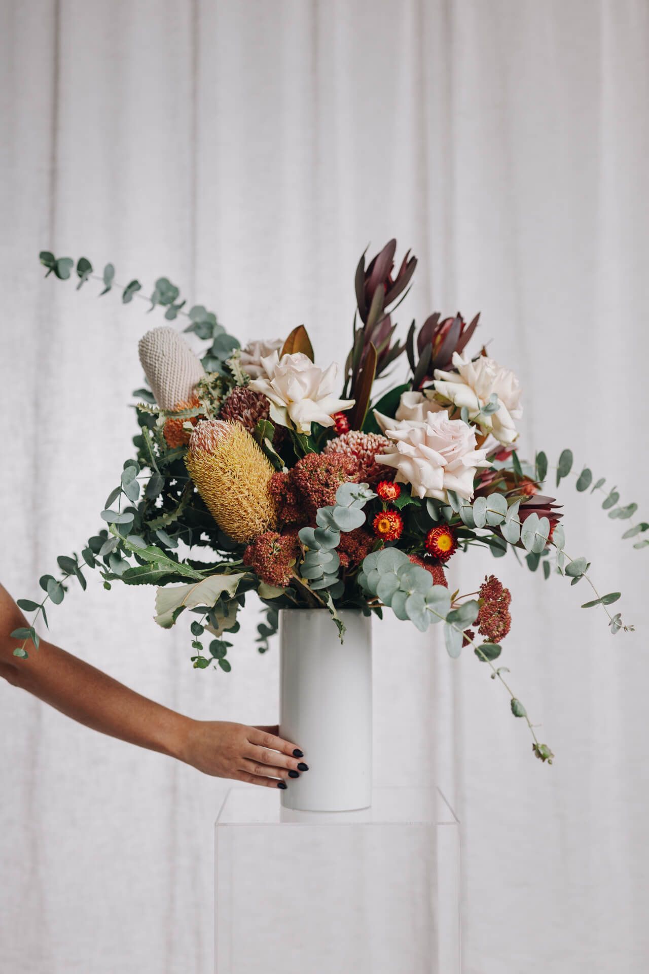 Bride is wearing a wedding ring and holding a bouquet of flowers — Flowers in Thirroul, NSW