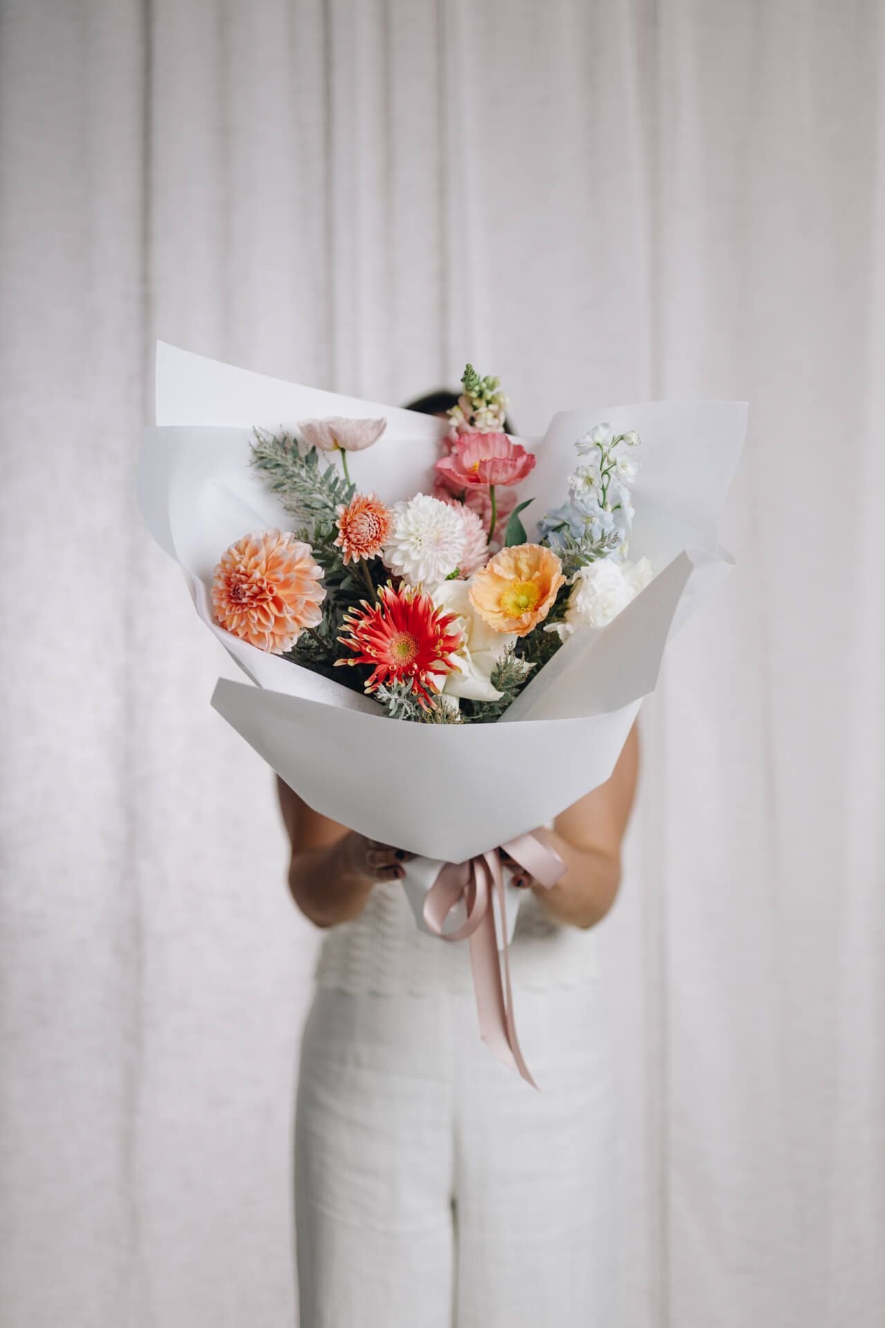 Person Holding a Colourful Bouquet - Florist in Wollongong, NSW