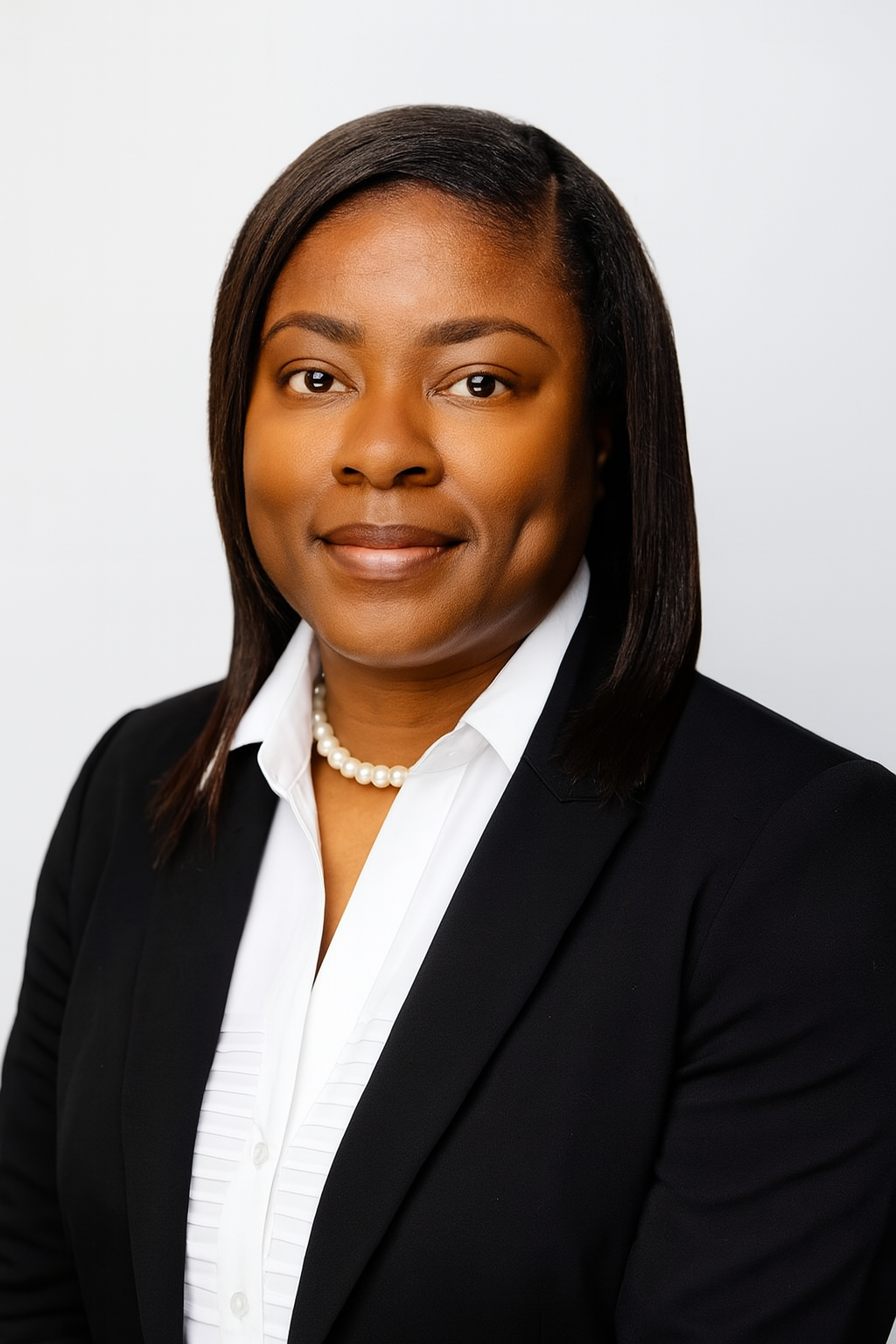 A picture of a woman in a white shirt in a black frame.