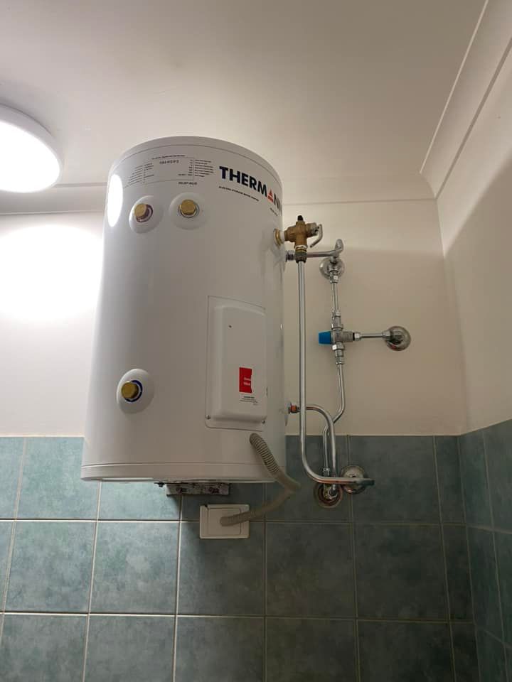 Solar Hot Water System on a Corrugated Metal Roof — Northern Plumbing Maintenance & Repairs in Leanyer, NT