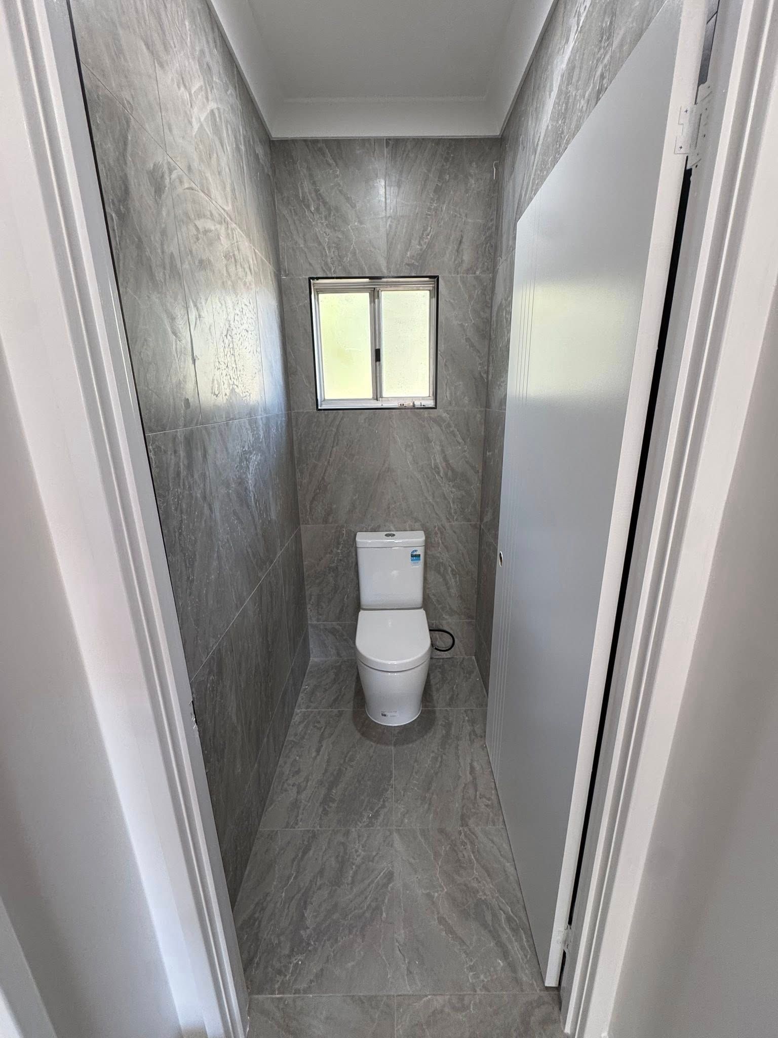 Narrow Bathroom With Toilet, Small Window — Northern Plumbing Maintenance & Repairs in Leanyer, NT