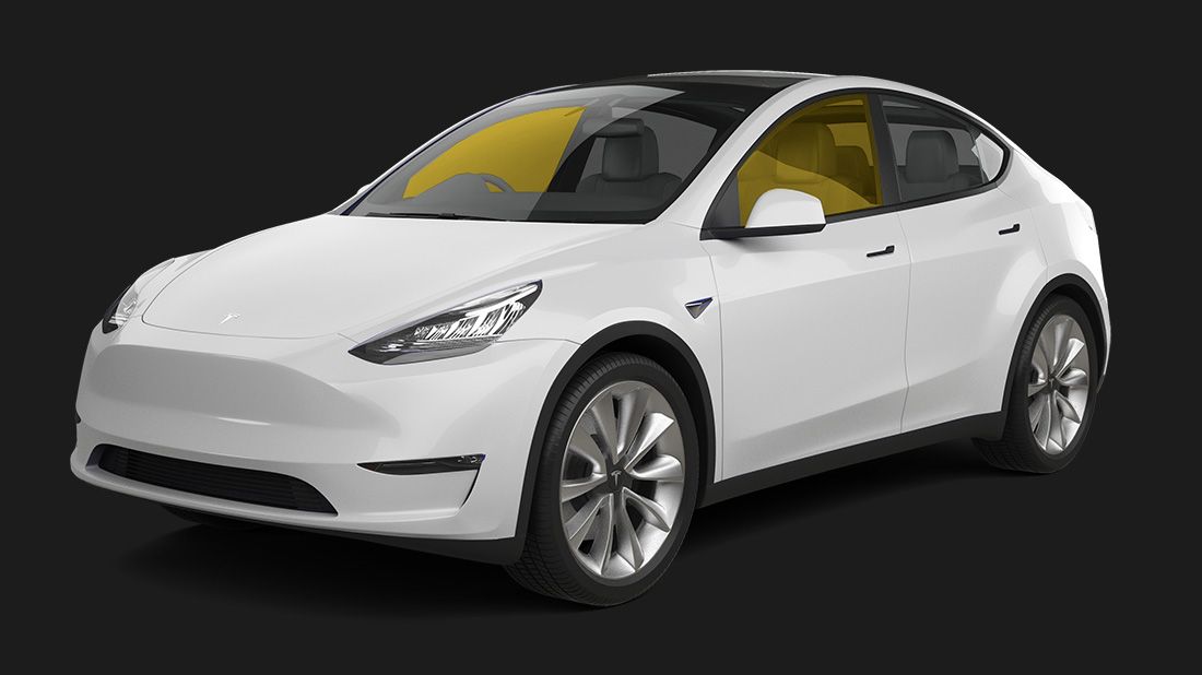 A white tesla model y with a yellow sunroof on a black background.