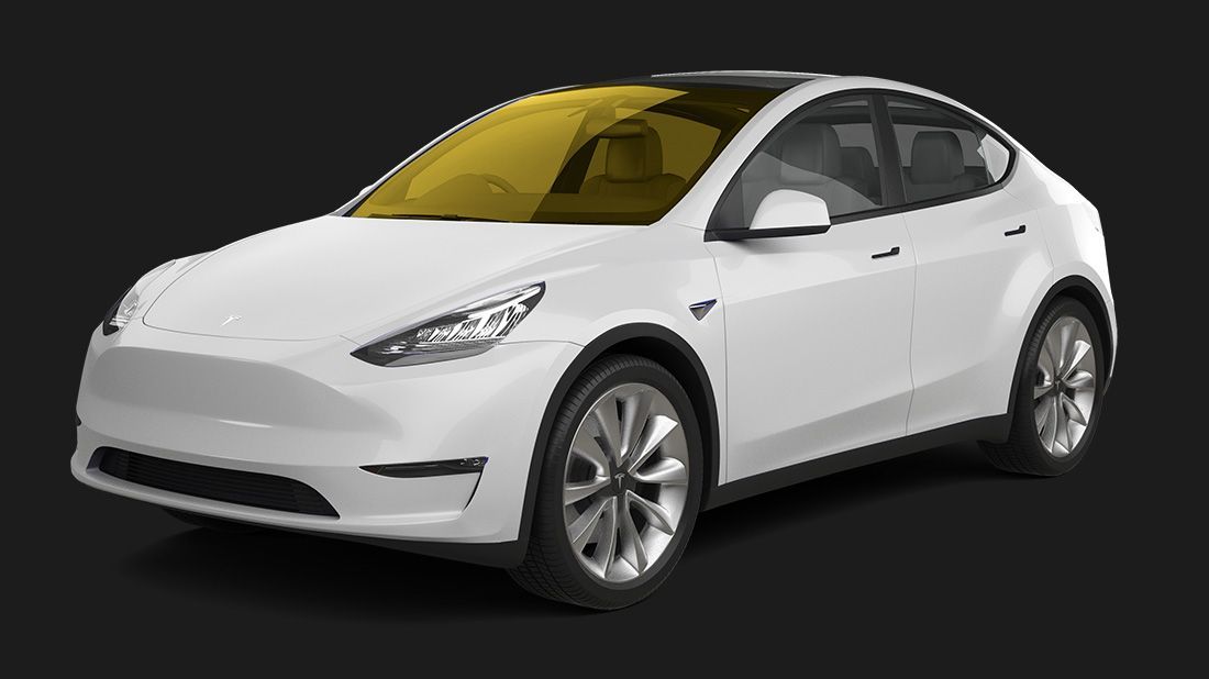 A white tesla model y with a yellow windshield on a black background.