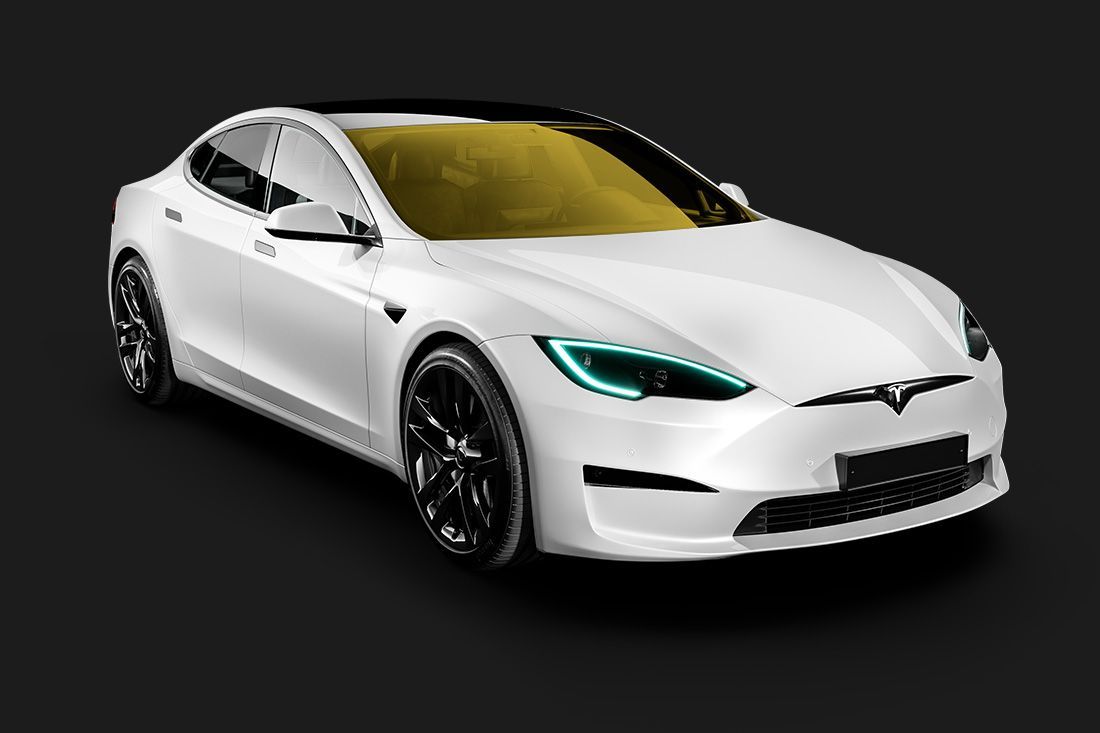 A white tesla model s with a yellow windshield on a black background.