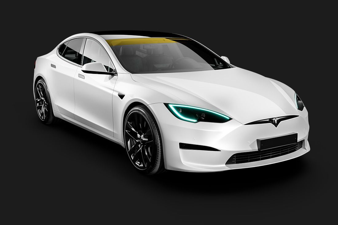 A white tesla model s with green lights on a black background.
