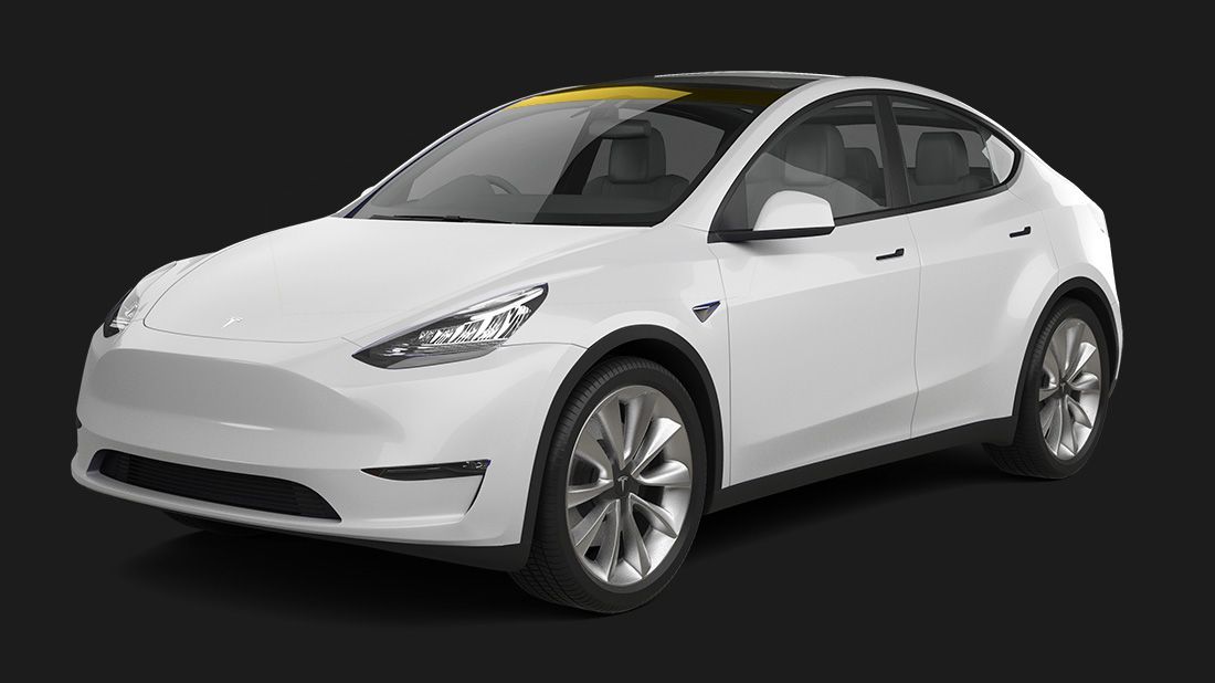 A white tesla model y is shown on a black background.