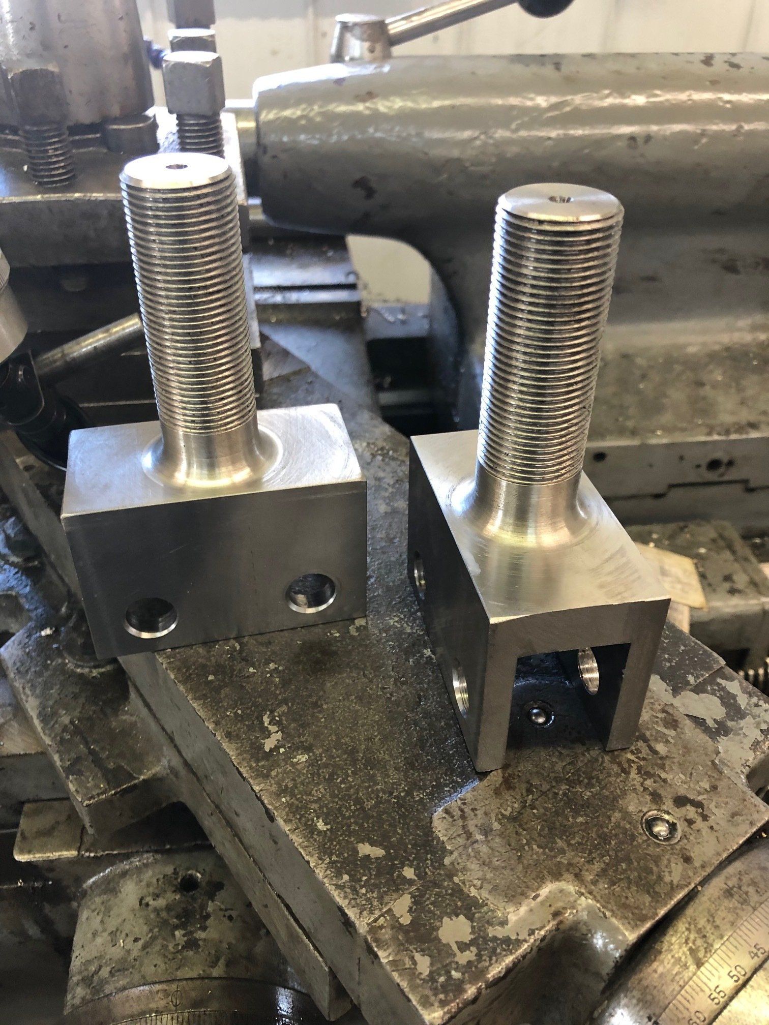 Two pieces of metal are sitting on top of each other on a table.