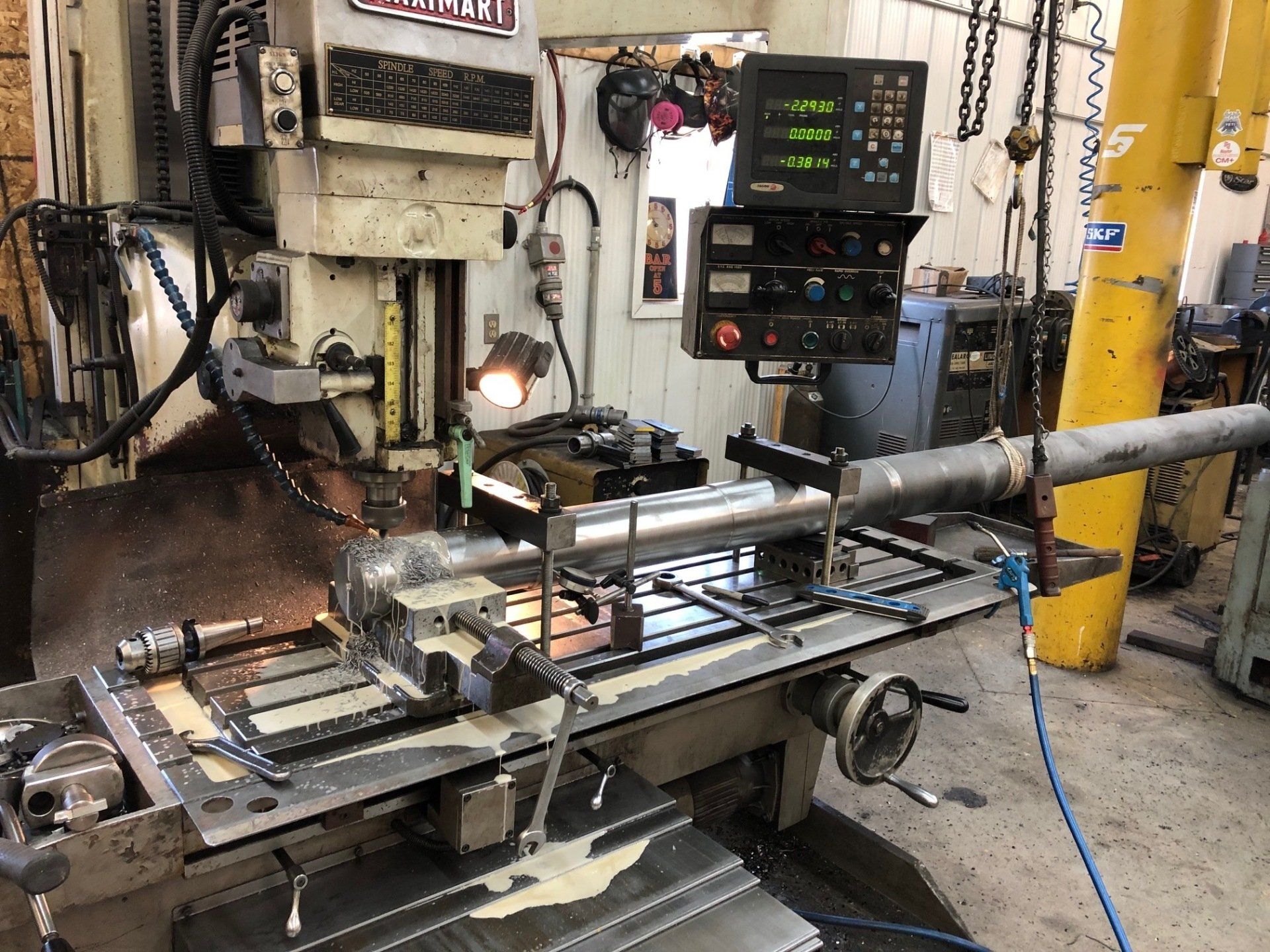 A machine is sitting on top of a table in a factory.
