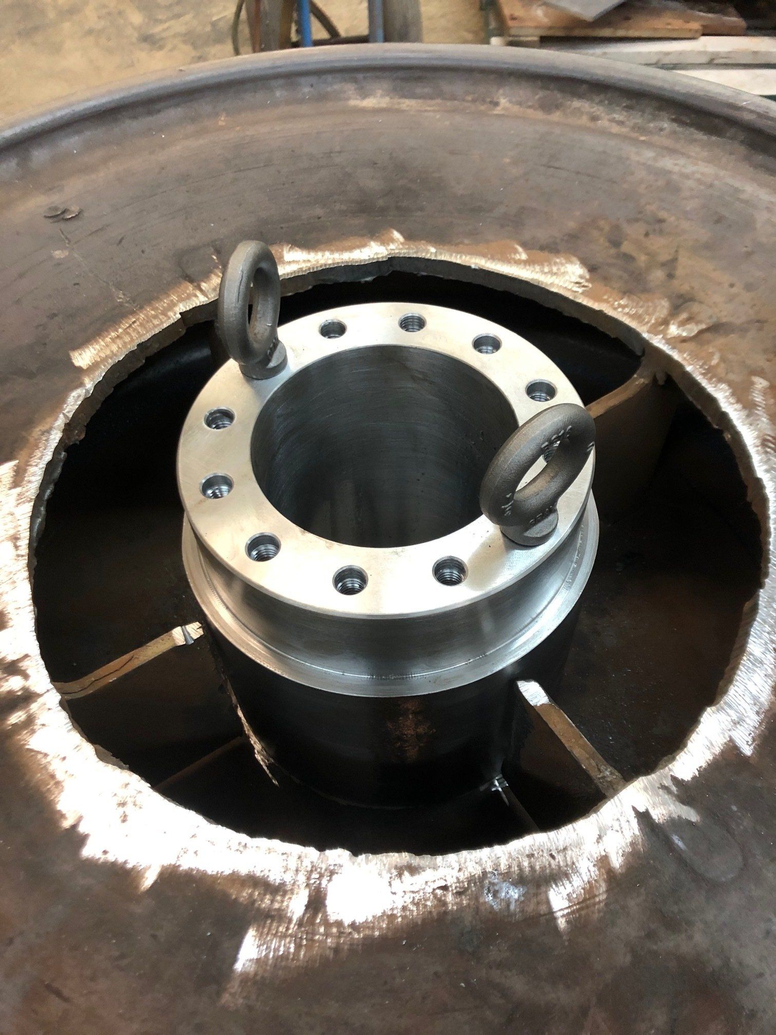 A metal object with a hole in the middle of it