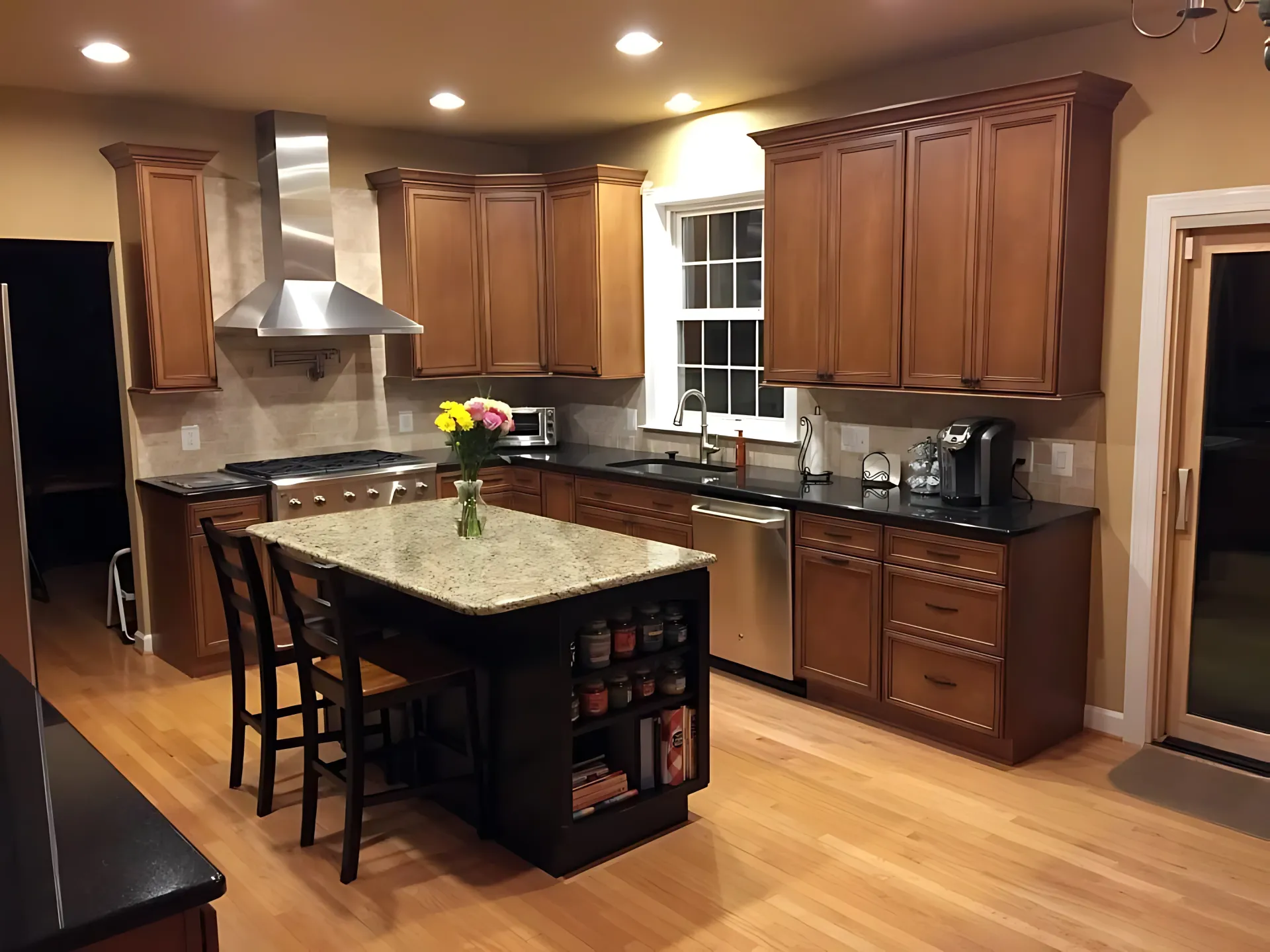 A kitchen with wooden cabinets and granite counter tops
