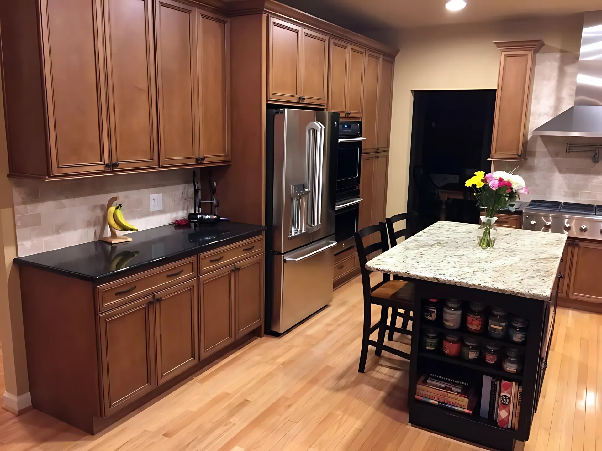 A kitchen with stainless steel appliances and wooden cabinets