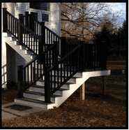 A Picture Of A Stairs With Black Handrail — Millersville, MD — Chesapeake Construction, Inc.