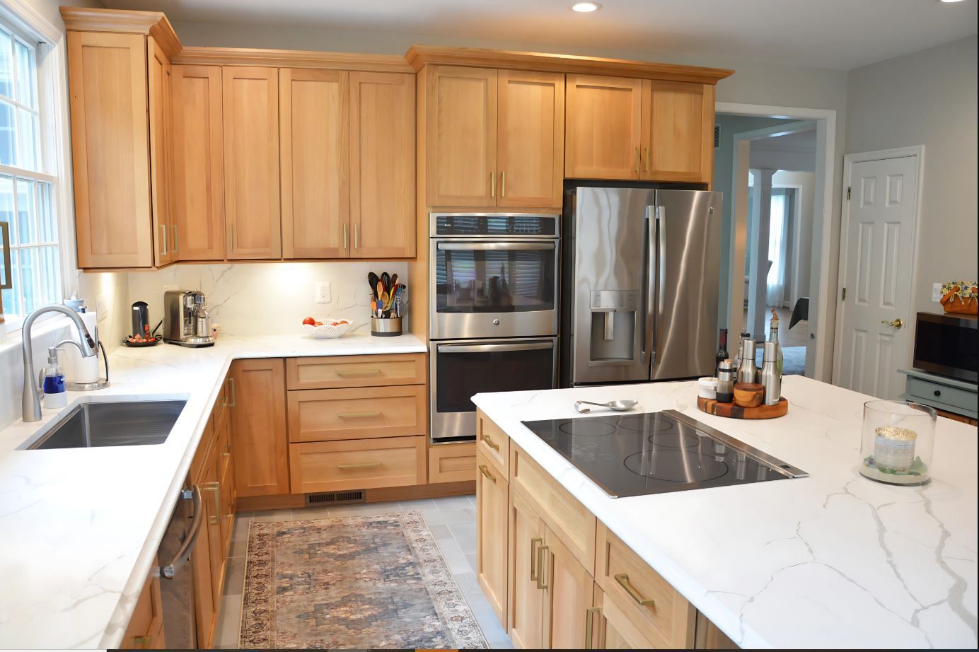 A kitchen with wooden cabinets and stainless steel appliances.