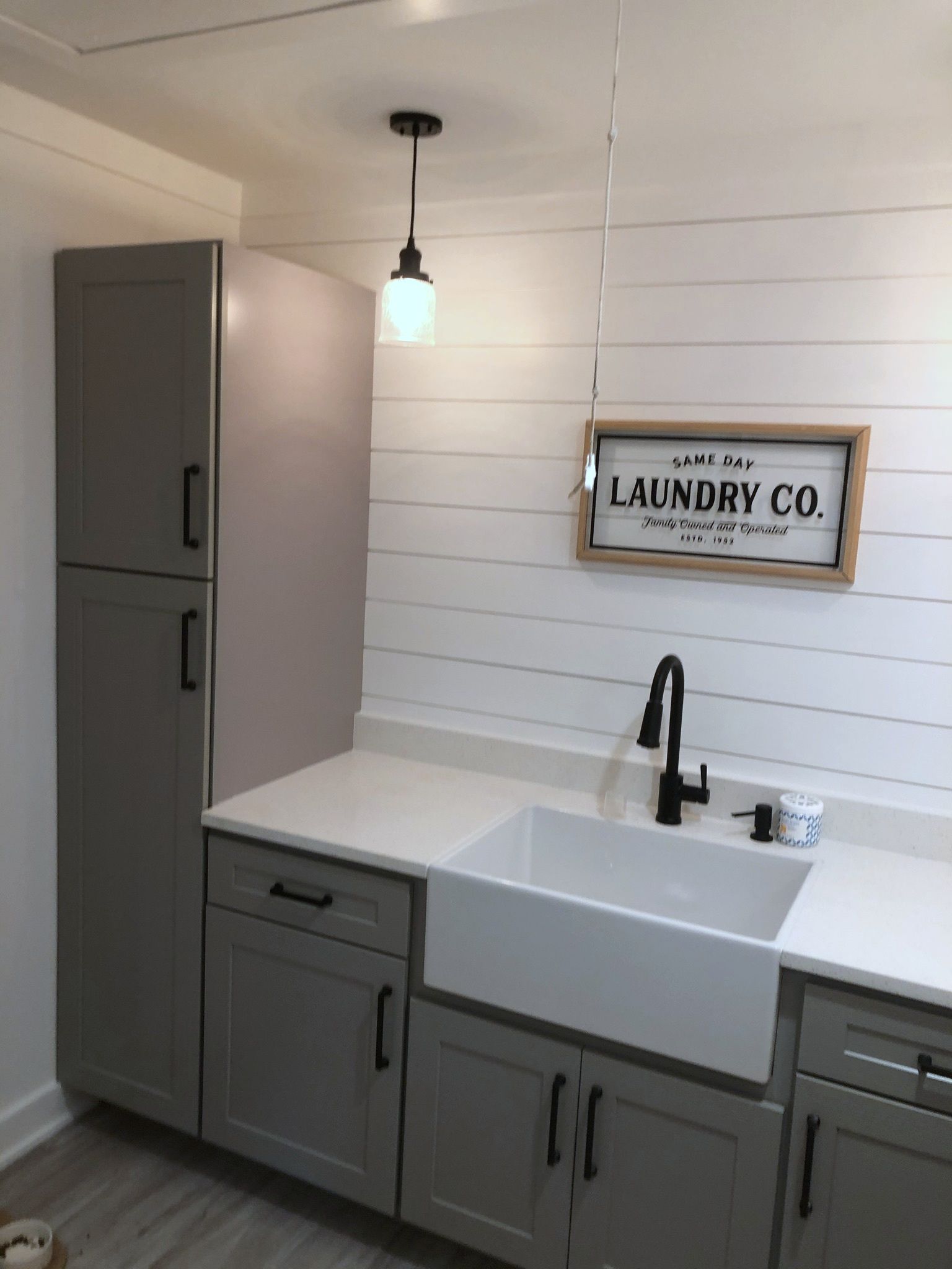 A laundry room with a sign that says laundry co.