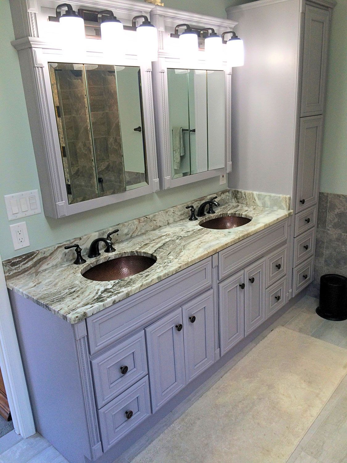 A bathroom with a tub , shower , sink and window.