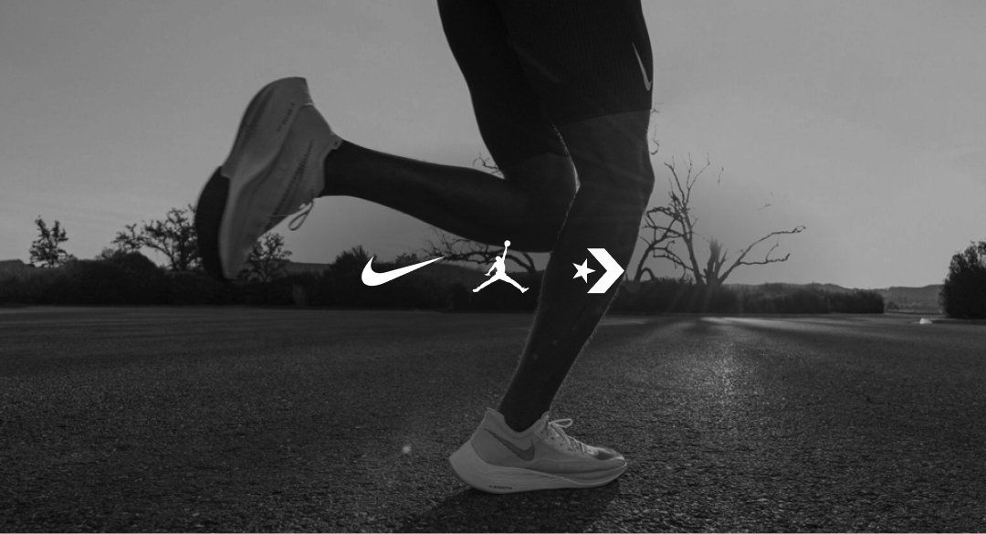 Nike tribrand logo lockup over an image of someone running on an open road at suns set