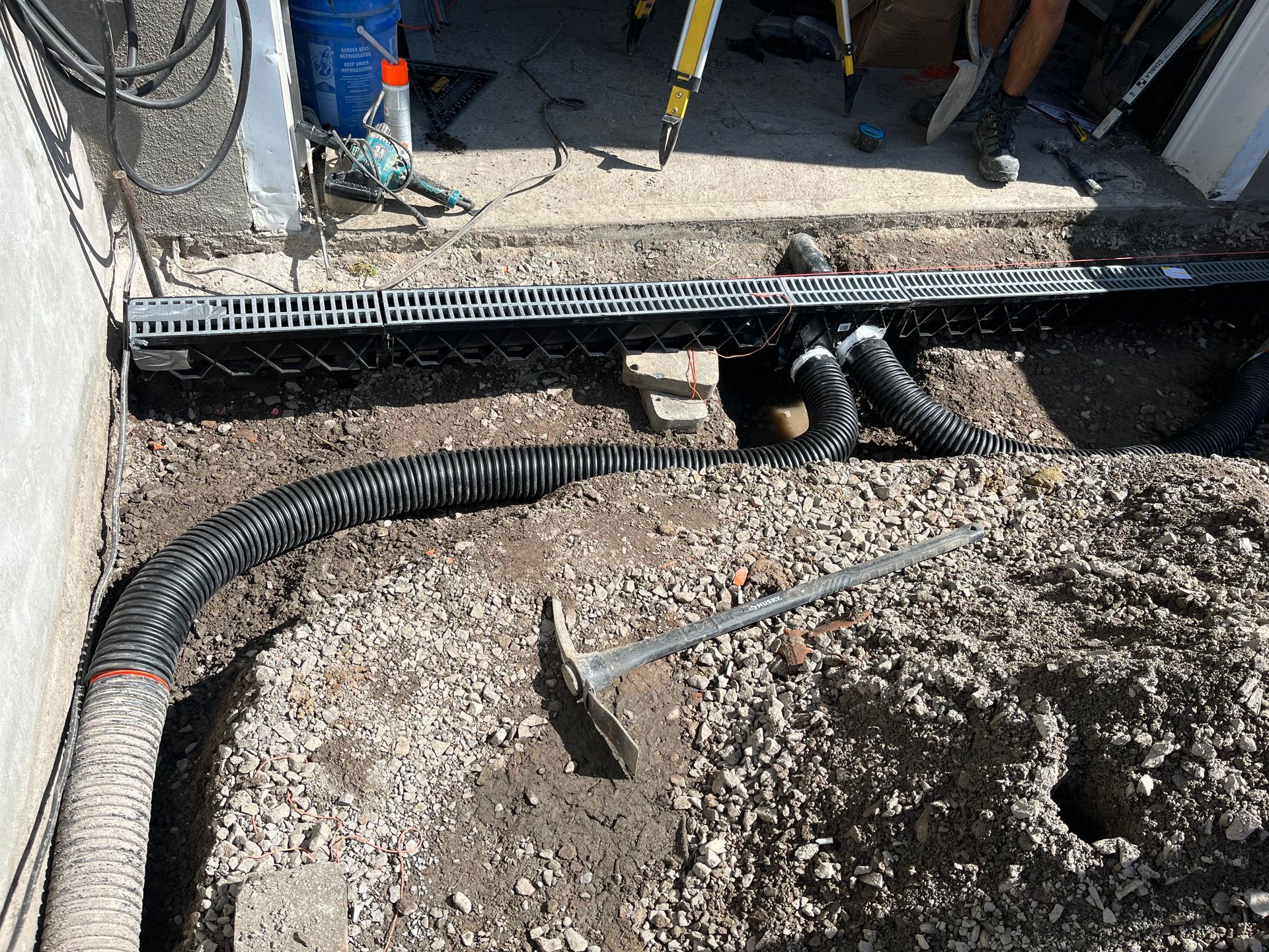 A vacuum cleaner is sitting on top of a pile of gravel.