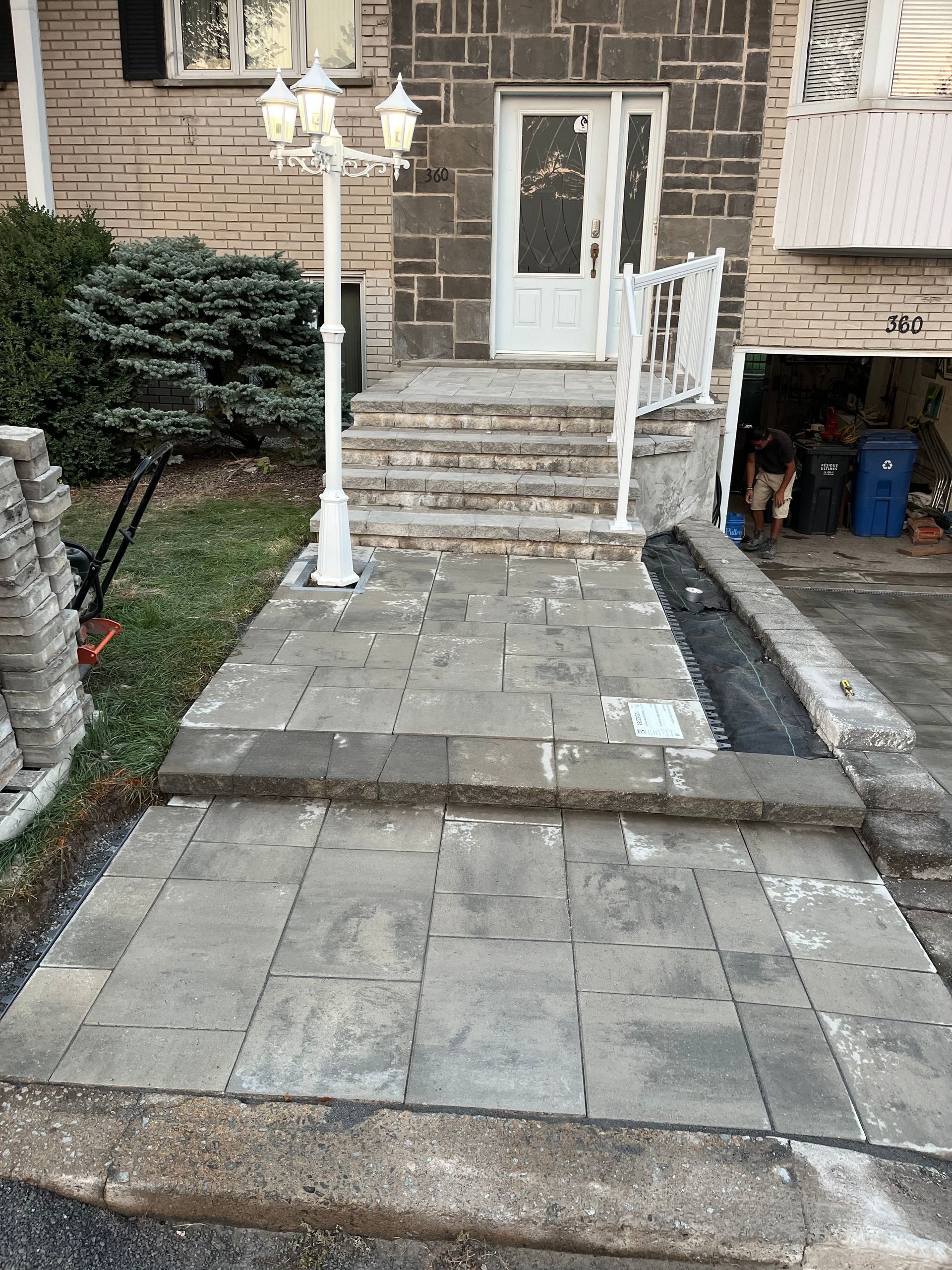 A stone walkway leading to the front door of a house