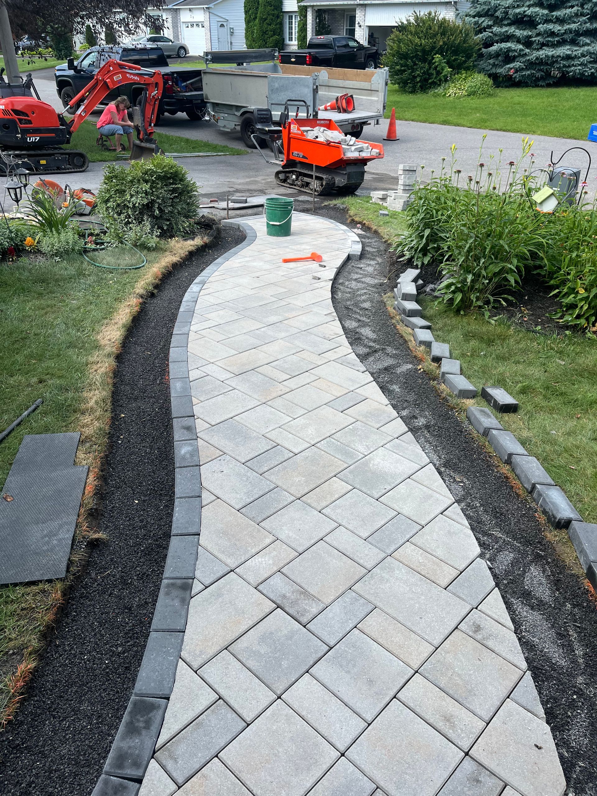 A walkway is being built in front of a house.