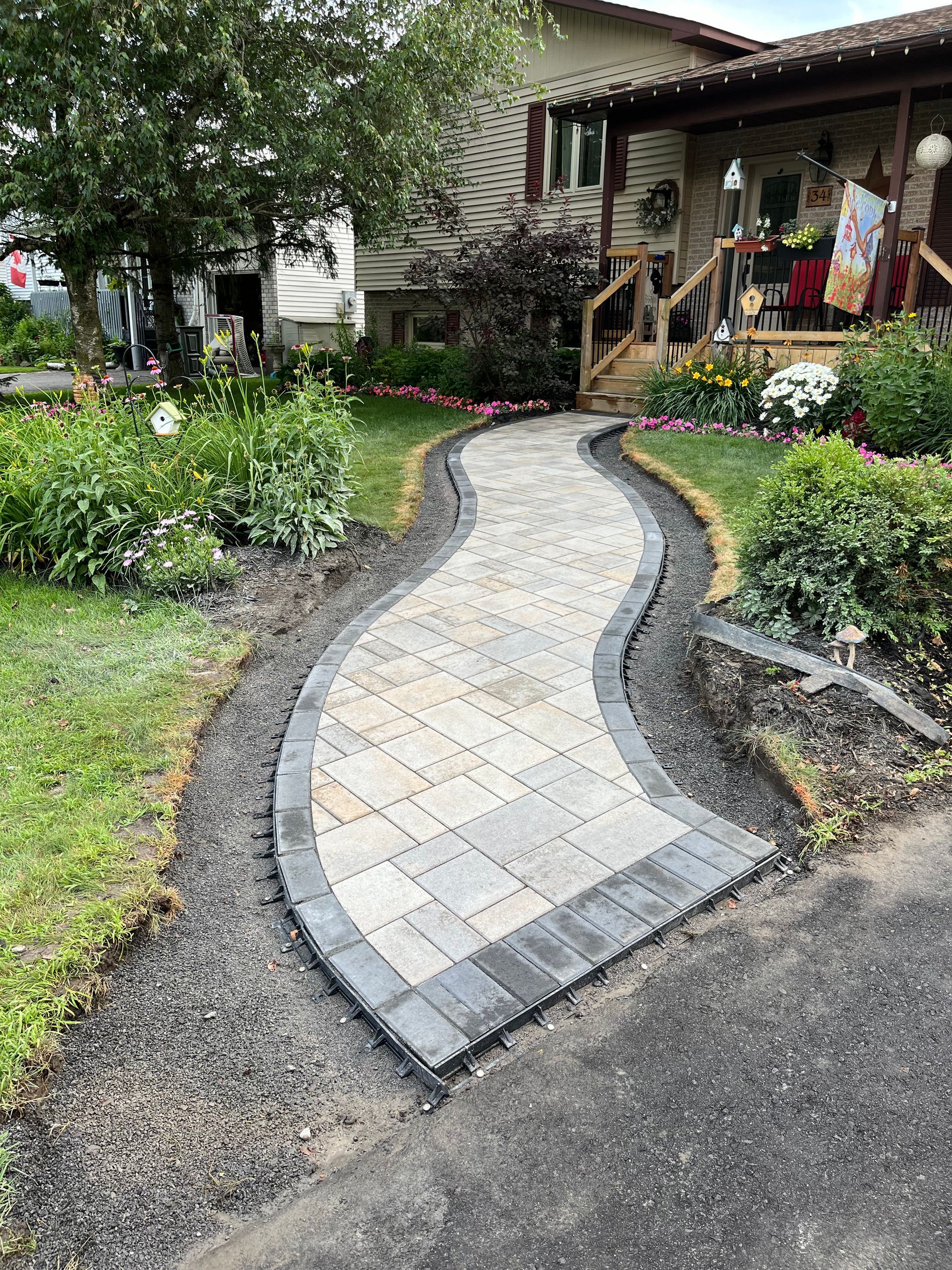 A walkway is being built in front of a house.
