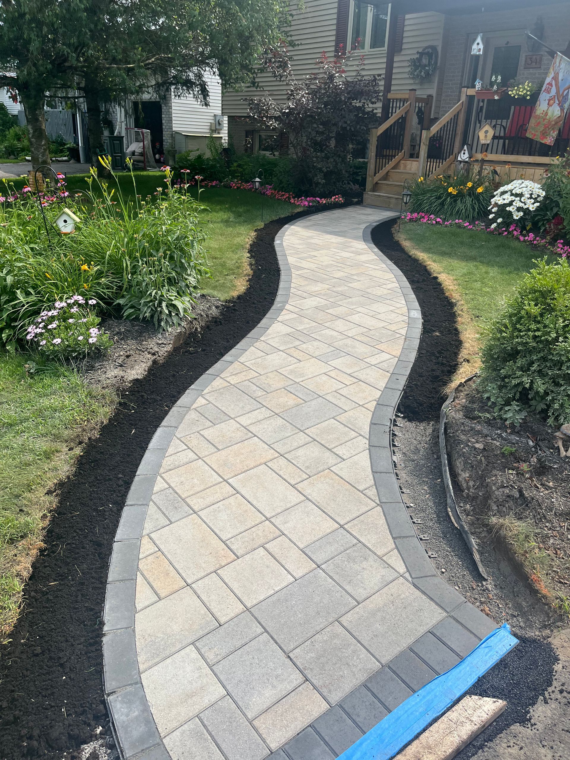 A walkway is being built in front of a house.