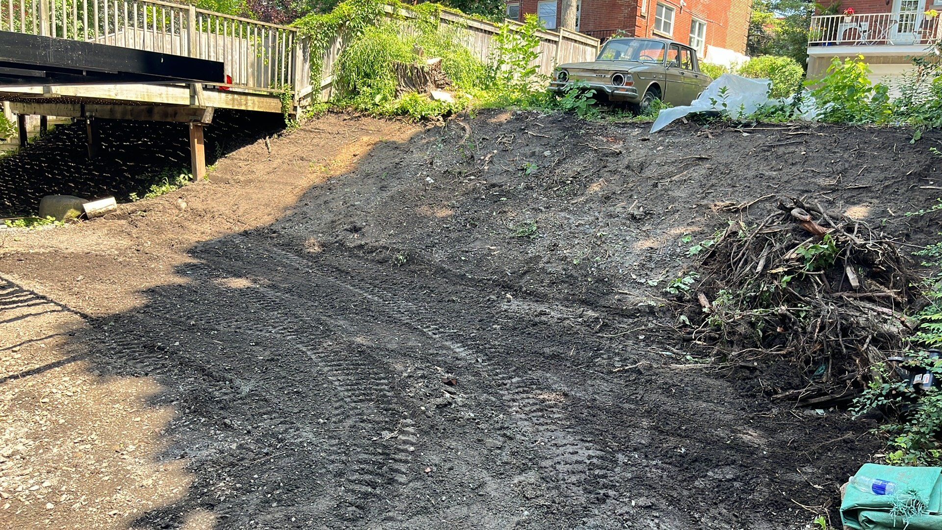 A large pile of dirt is sitting on top of a dirt hill.