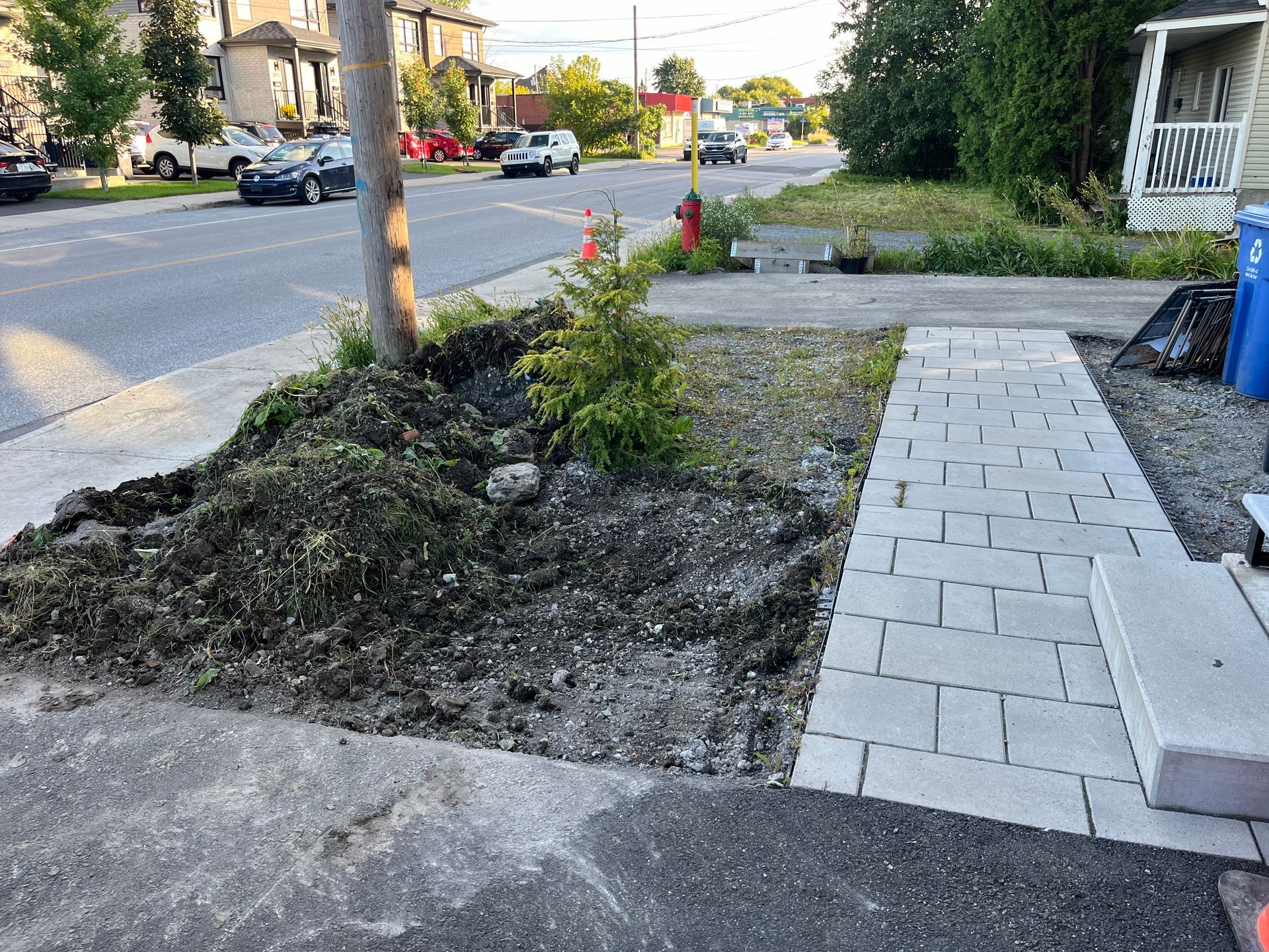 A sidewalk is being built in front of a house.