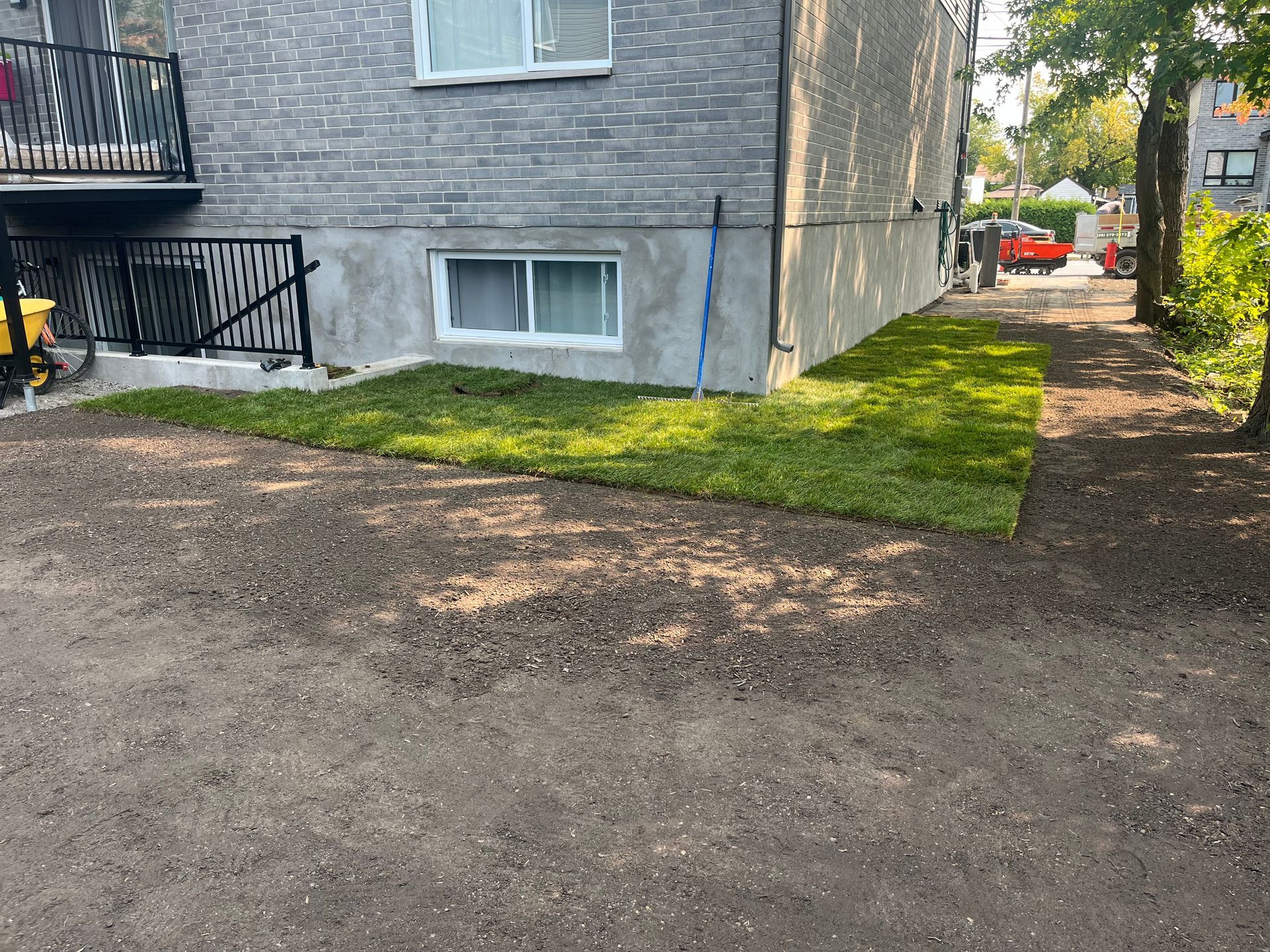 A house with a lot of grass in front of it.