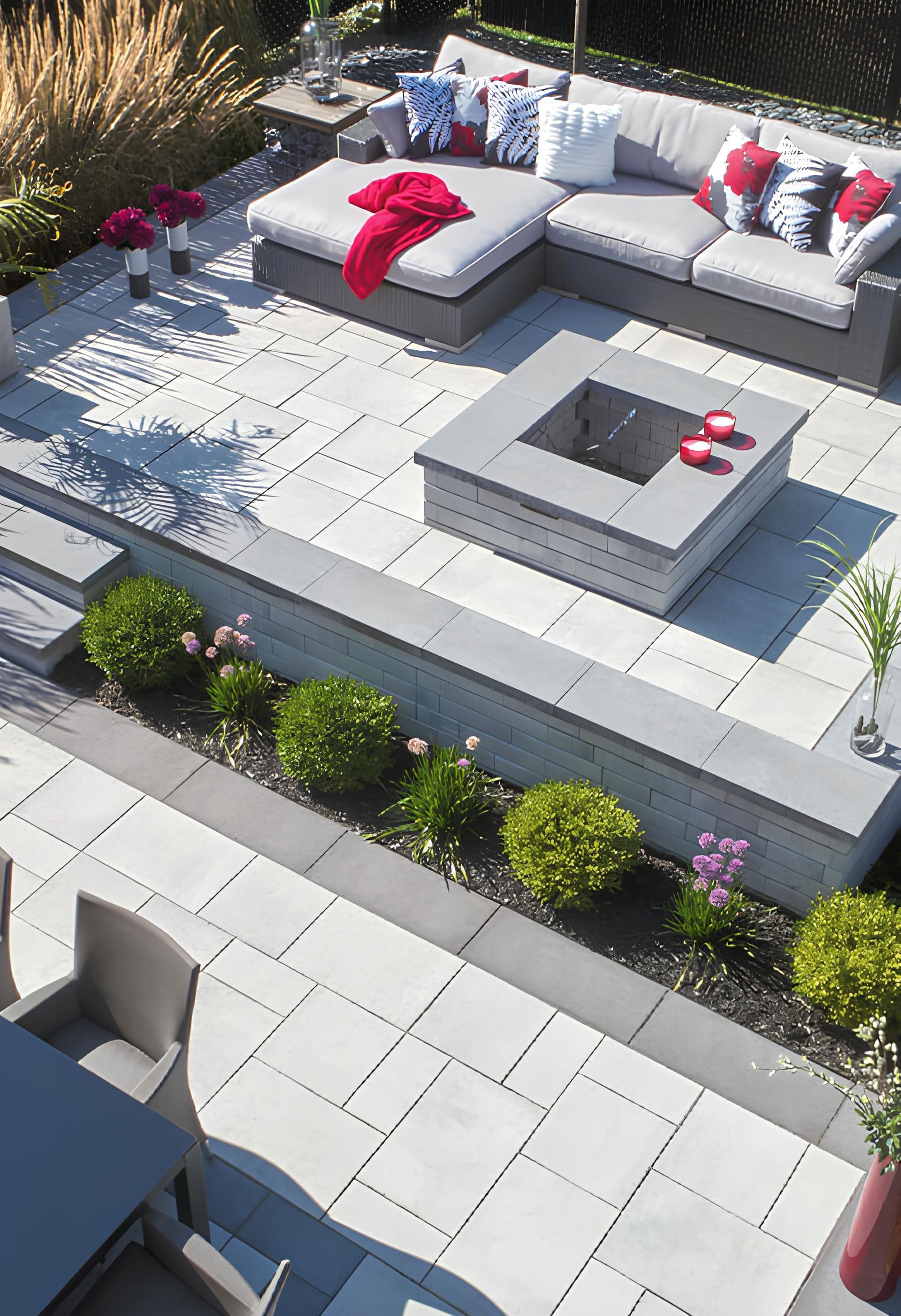 An aerial view of a patio with furniture and a fire pit