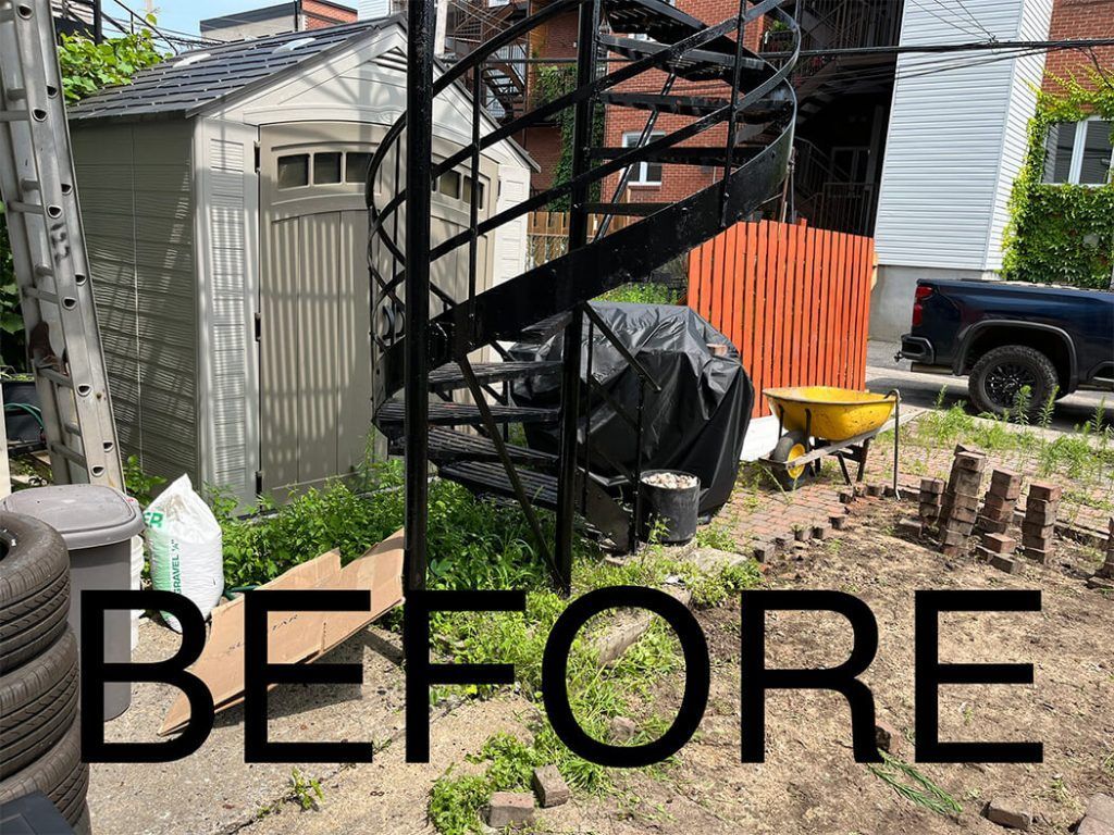 A before picture of a spiral staircase in a backyard.