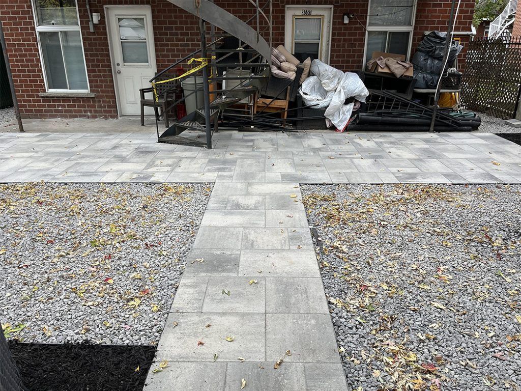 A brick building with a walkway leading to it.