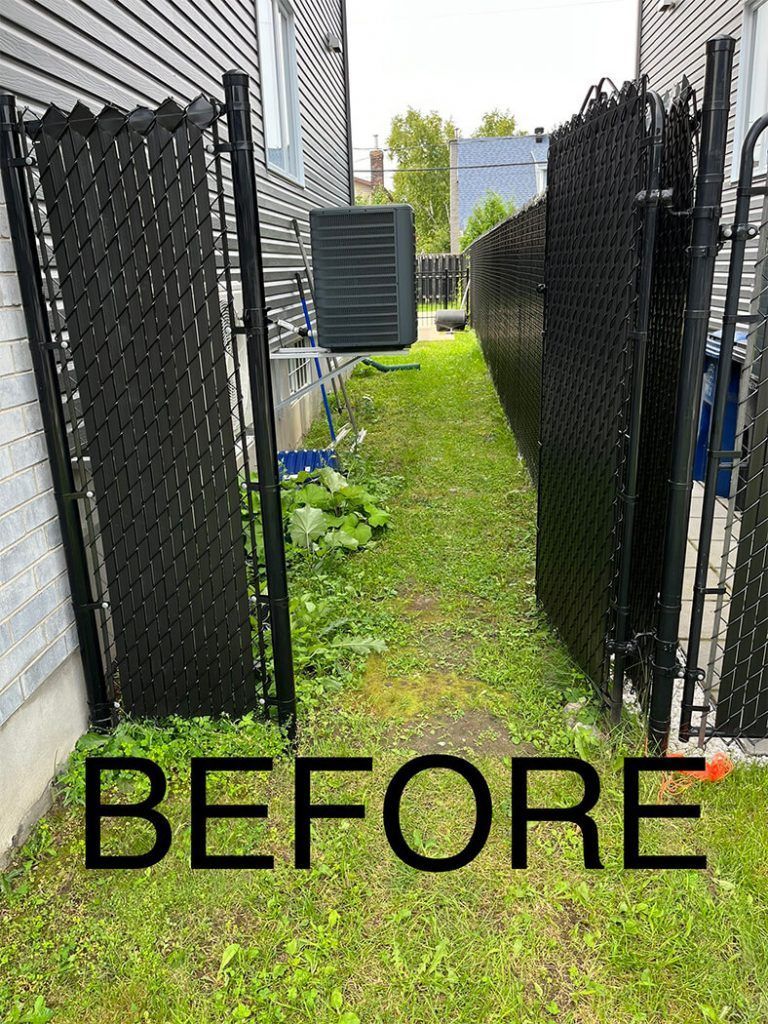 A before picture of a backyard with a chain link fence.