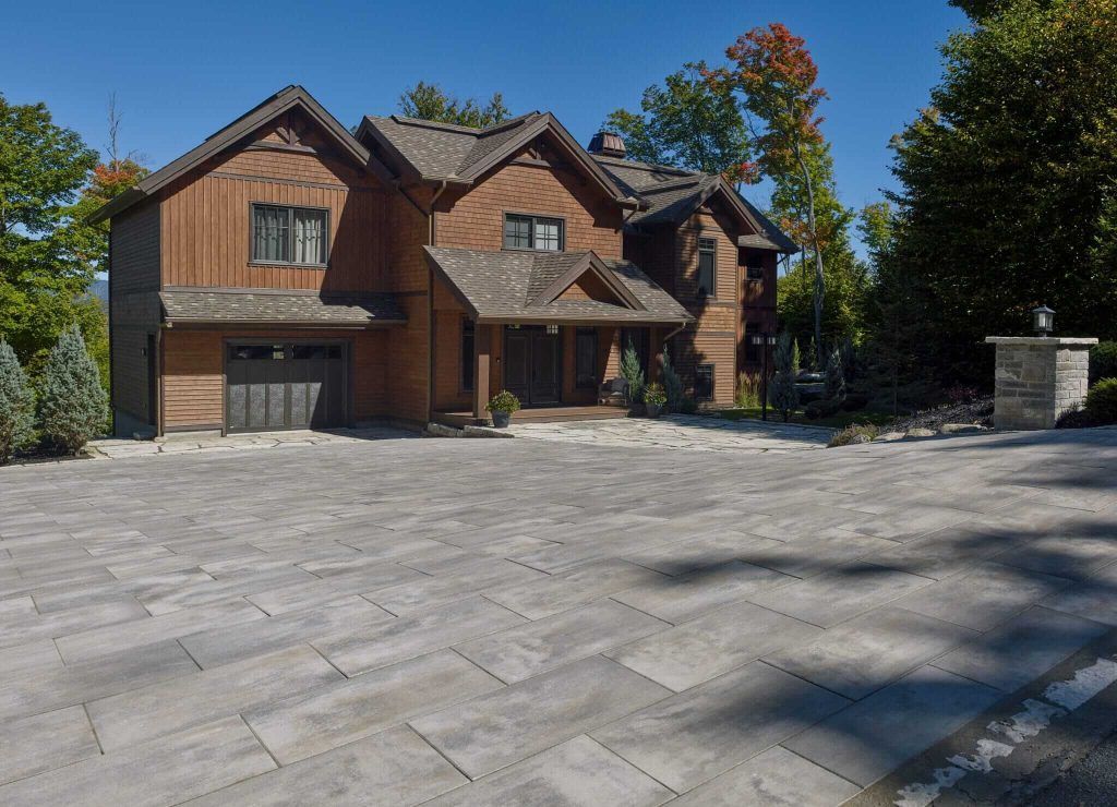 A large house with a driveway in front of it