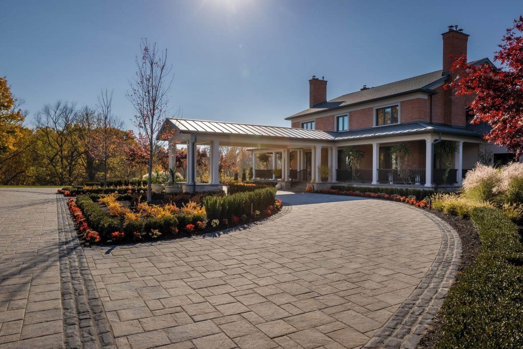 A large house with a large driveway leading to it