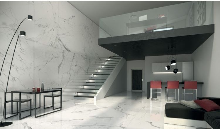 Modern loft interior with marble walls and floors, staircase, mezzanine, black accents, and red bar stools.