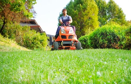 Gardener Driving a Lawn Mower — Roseville, MI — S & B Seasonal Services