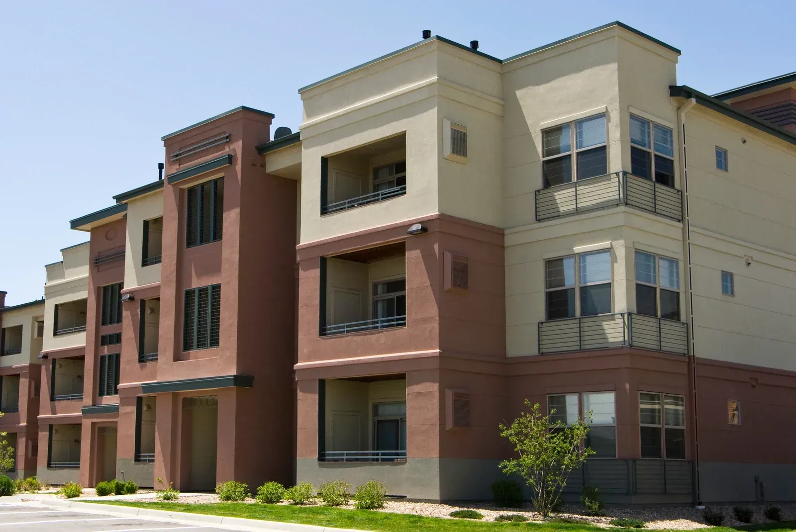 A large apartment building with a lot of windows and balconies